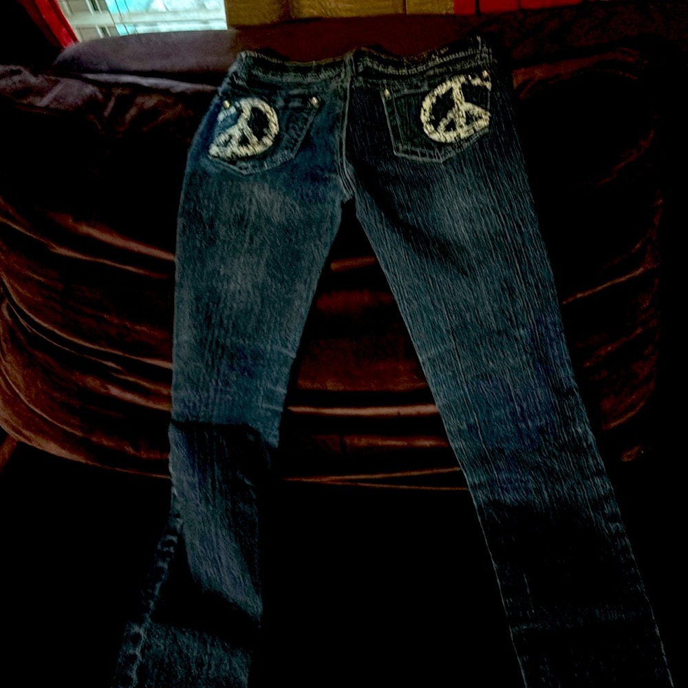 Girls jeans size 12 very stretchy, peace sign pockets